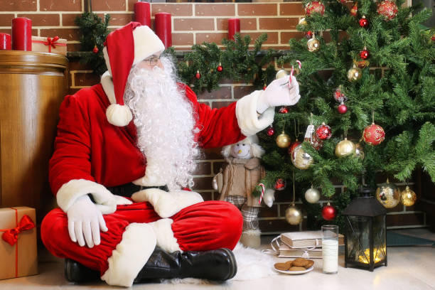 istock Santa Claus with gifts Christmas tree 1162947492