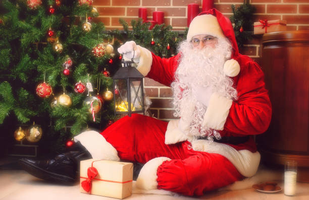 istock Santa Claus with Christmas tree 1162947587