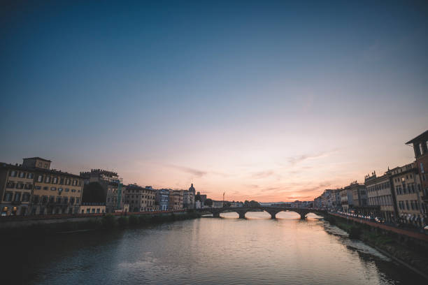 istock Florence , Italy river bank dusk hour with reflection 1162948143