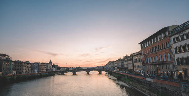 istock Florence , Italy river bank dusk hour with reflection 1162948308