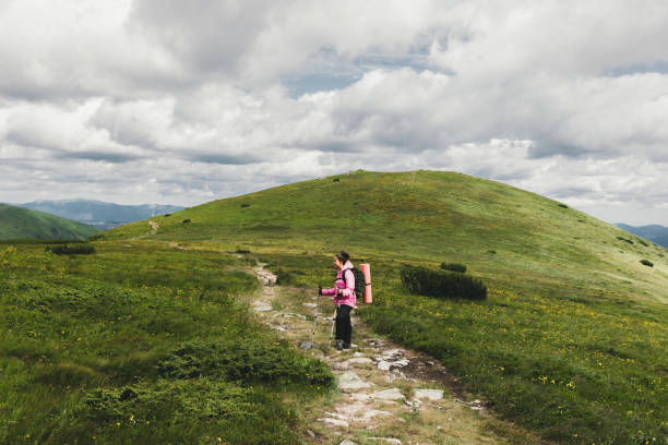istock Young woman hiking in the mountains 1162949963