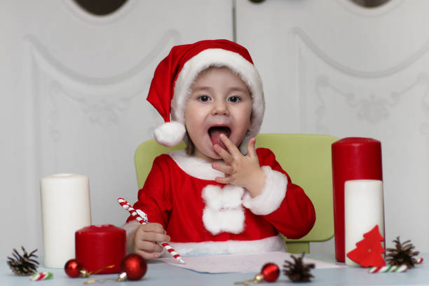 istock Little kid are writing letter to Santa 1162950003
