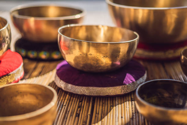 istock Tibetan singing bowls on a straw mat 1162950109