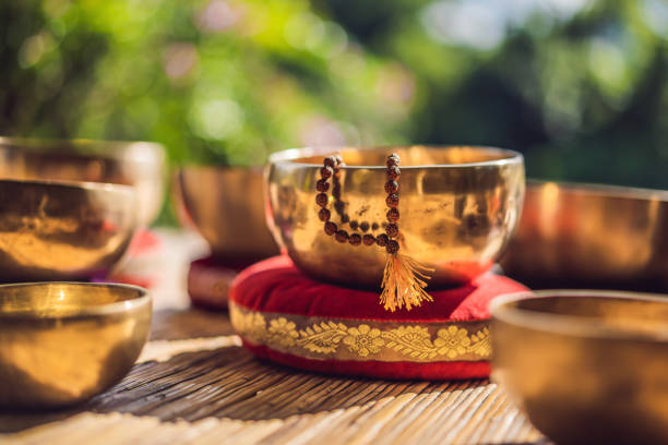 istock Tibetan singing bowls on a straw mat 1162954940