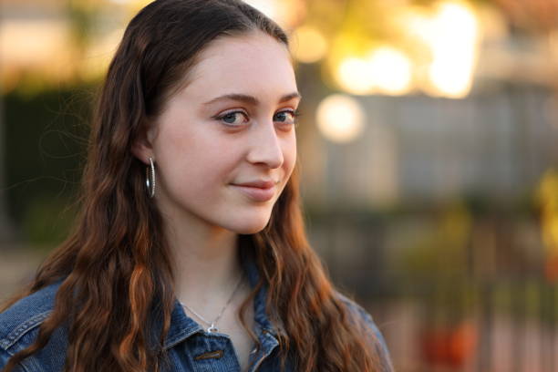 istock Smiling young woman in the afternoon sun 1162955705