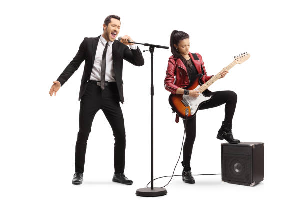 cantante masculino cantando y una joven tocando una guitarra eléctrica - isolated on white studio shot guitar young men fotografías e imágenes de stock