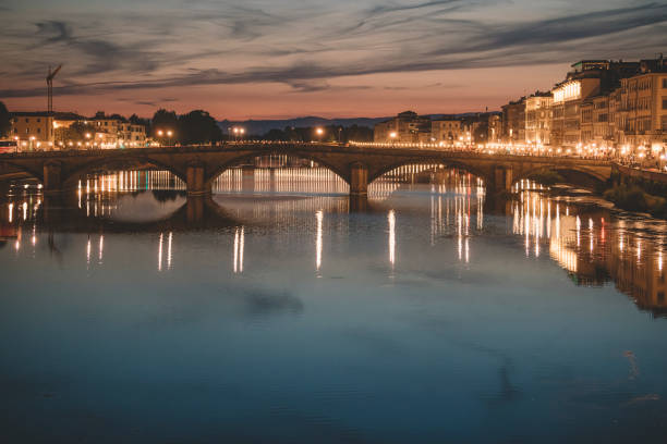 istock Florence , Italy river bank dusk hour with reflection 1162956041