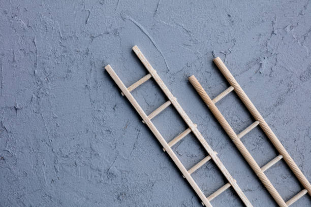 istock Wooden ladder on gray background 1162956278