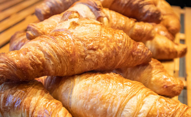 istock French croissants in a shop display, closeup view 1162956948