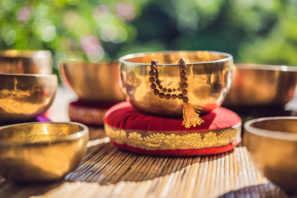 istock Tibetan singing bowls on a straw mat 1162957009