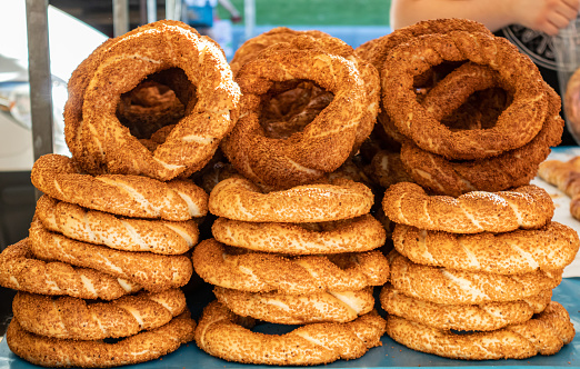 Traditional turkish simit, sesame bread ring bagels, street food closeup view