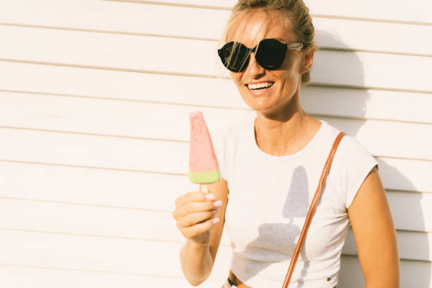 istock A cheerful beautiful white girl in sunglasses laughs 1162957406