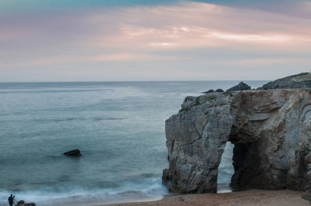 istock arch on sunset background  in Quiberon - Britain 1162958793
