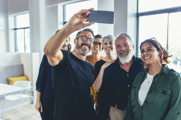 istock successful multiracial business team taking selfie 1162959928