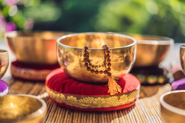 istock Tibetan singing bowls on a straw mat 1162961635