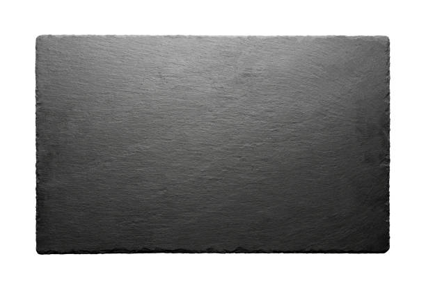 istock Black slate roof tile isolated on white background. 1162961737
