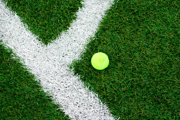 istock Tennis ball lying on the lawn. artificial turf 1162961855