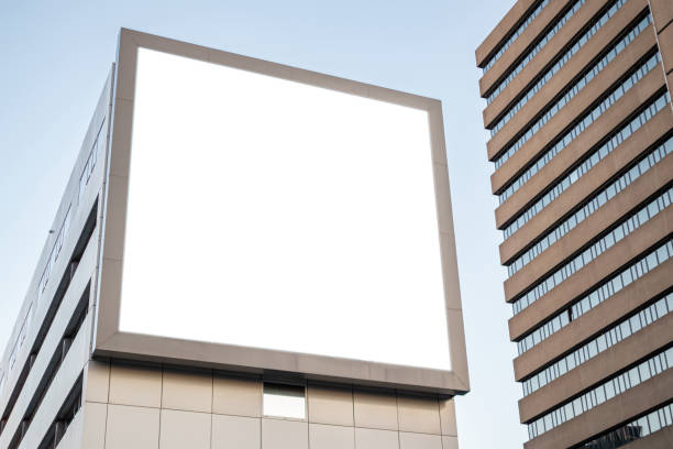 istock Blank billboard mockup for advertising on a building facade 1162964480