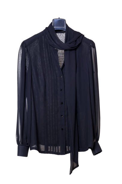 istock Black chiffon blouse weighs on  hanger on white background 1162966889