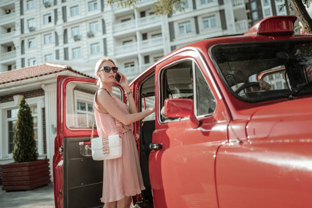istock Woman calling her daughter before getting into the car. 1162969041