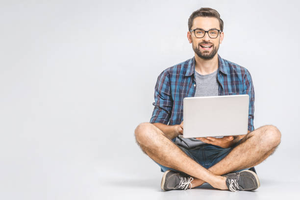 istock Online working concept. Casual business man relaxed working and browsing internet on laptop computer. Freelance sitting and typing on laptop keyboard at home office. Close up 1162969191