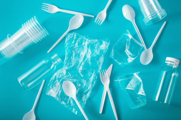 istock single use plastic cups, forks, spoons, bottles. concept of recycling plastic, plastic waste 1162970844