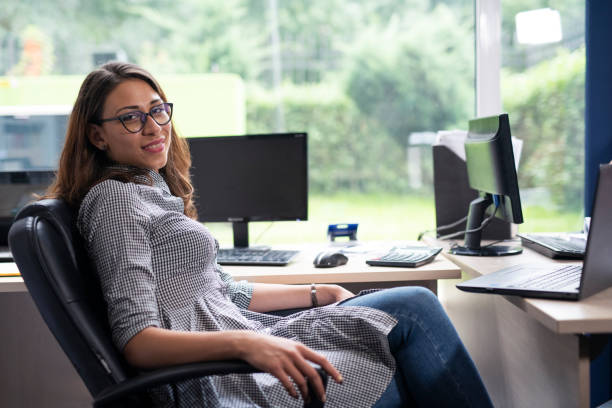 istock Smiling businesswoman in office. 1162972218