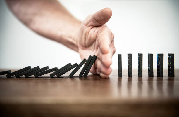 Domino Falling dominoes | Domino effect clean and jerk stock pictures, royalty-free photos & images