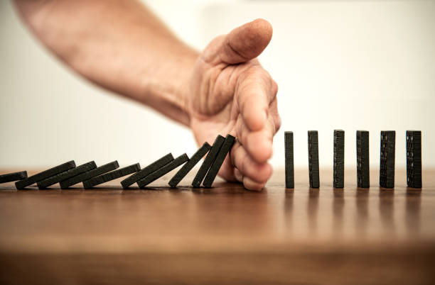 Domino Falling dominoes | Domino effect clean and jerk stock pictures, royalty-free photos & images