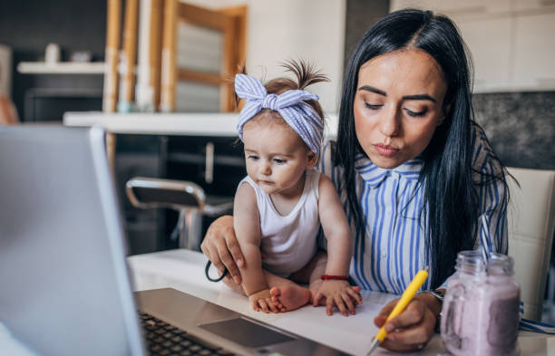 istock Young mother babysitting at home 1162974948