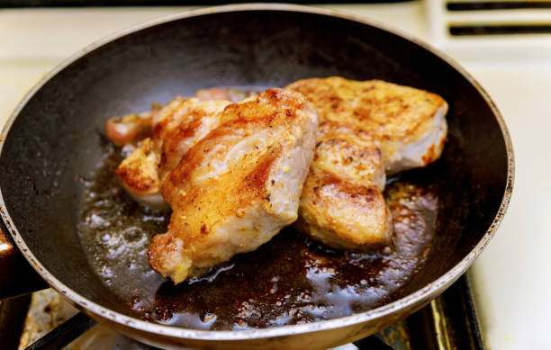 istock Fried chopsteak meat in a frying pan, close up 1162976554