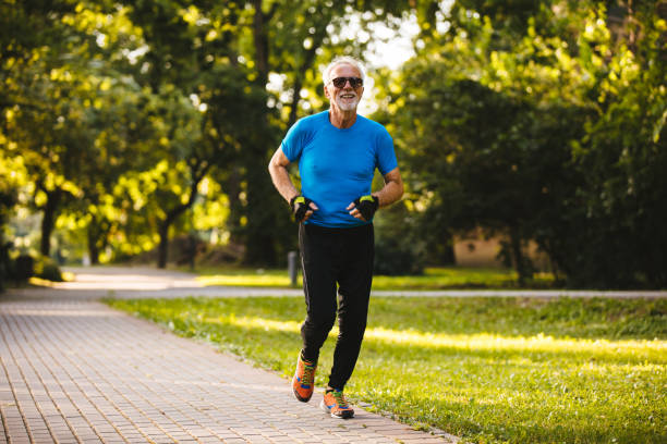 istock Senior man jogging in the park 1162977037