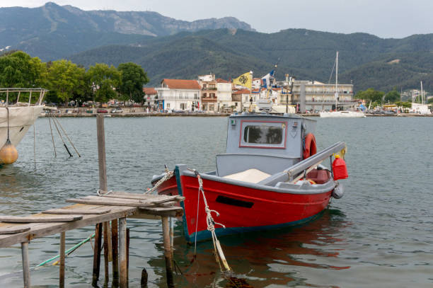 istock Fishing boat in a small seaport 1162979963