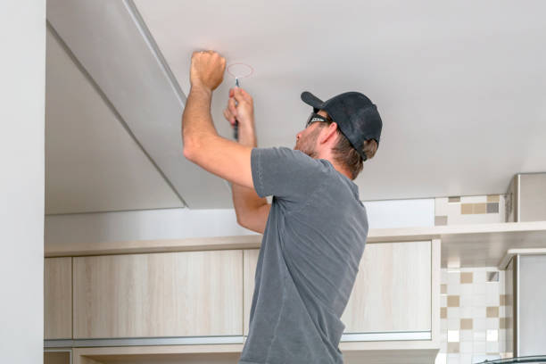 istock Man fixing the light at home. 1162984791