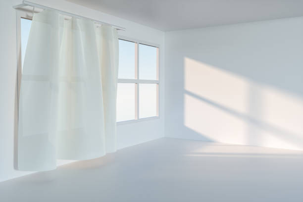istock An empty room with sunshine come through the curtain, 3d rendering. 1162985177