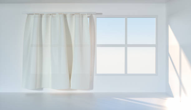 istock An empty room with sunshine come through the curtain, 3d rendering. 1162985283