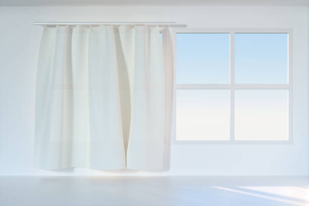 istock An empty room with sunshine come through the curtain, 3d rendering. 1162985287