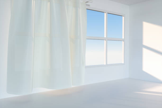 istock An empty room with sunshine come through the curtain, 3d rendering. 1162985300