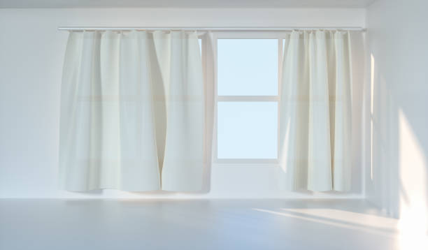 istock An empty room with sunshine come through the curtain, 3d rendering. 1162985331