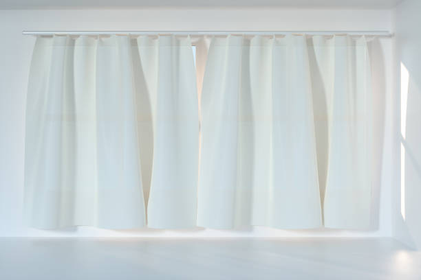 istock An empty room with sunshine come through the curtain, 3d rendering. 1162985370