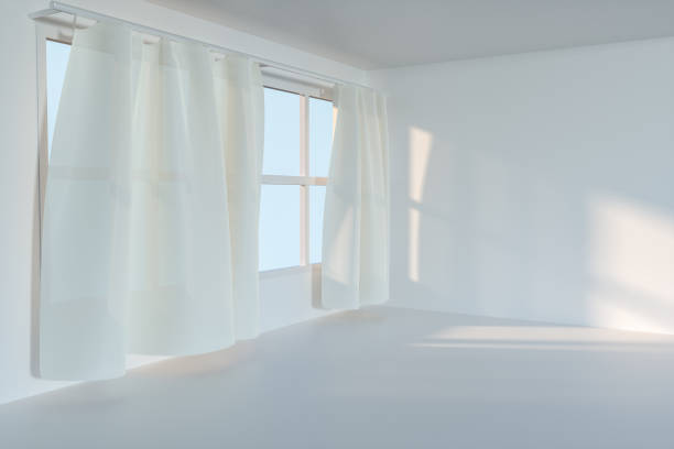 istock An empty room with sunshine come through the curtain, 3d rendering. 1162985372