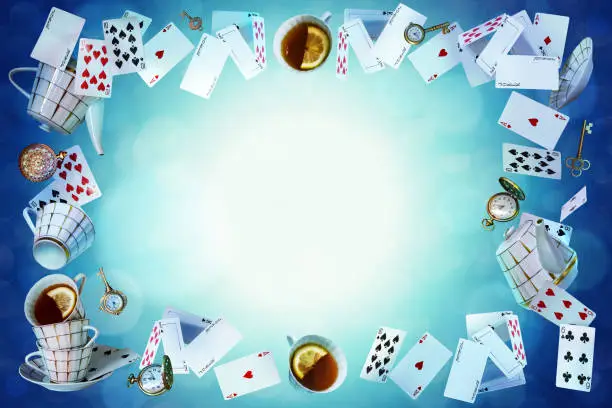 Wonderland background. Mad tea party.Playing cards, pocket watch, key, cup and teapot falling down the rabbit hole