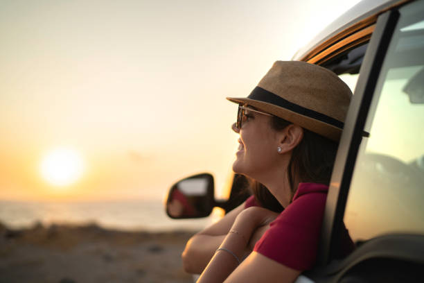 istock Woman leaning out car window 1162988283
