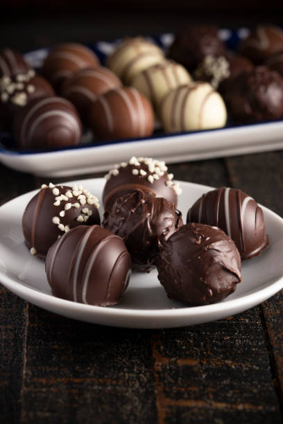 istock A Moody Image of Chocolate Truffles on a Rustic Wooden Table 1162988398