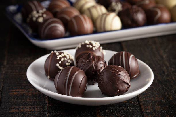 istock A Moody Image of Chocolate Truffles on a Rustic Wooden Table 1162988408
