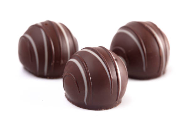 istock Dark Chocolate Truffles Isolated on a White Backgroun 1162989905