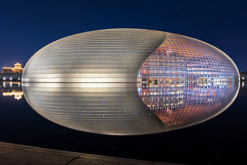 Beijing,China - May 16, 2019: The National Center for the performing arts, the National Grand Theater like an egg shape,reflection is clearly at night.A landmark building as one of the new 16 scenes in Beijing.
