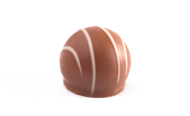 istock Milk Chocolate Truffles Filled with Vanilla Isolated on a White Backgroun 1162990293