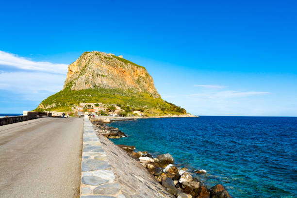 Protected ancient fortress on island rock Monemvasia, view from mainland, Peloponnese treasures, Greece Protected ancient fortress and town on island rock Monemvasia, view from mainland, Peloponnese treasures, Greece monemvasia stock pictures, royalty-free photos & images