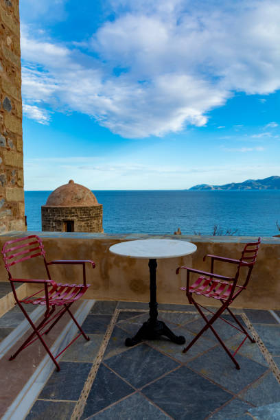 istock Greek cafe or tavern with small table on outside terrace with nice view 1162991988